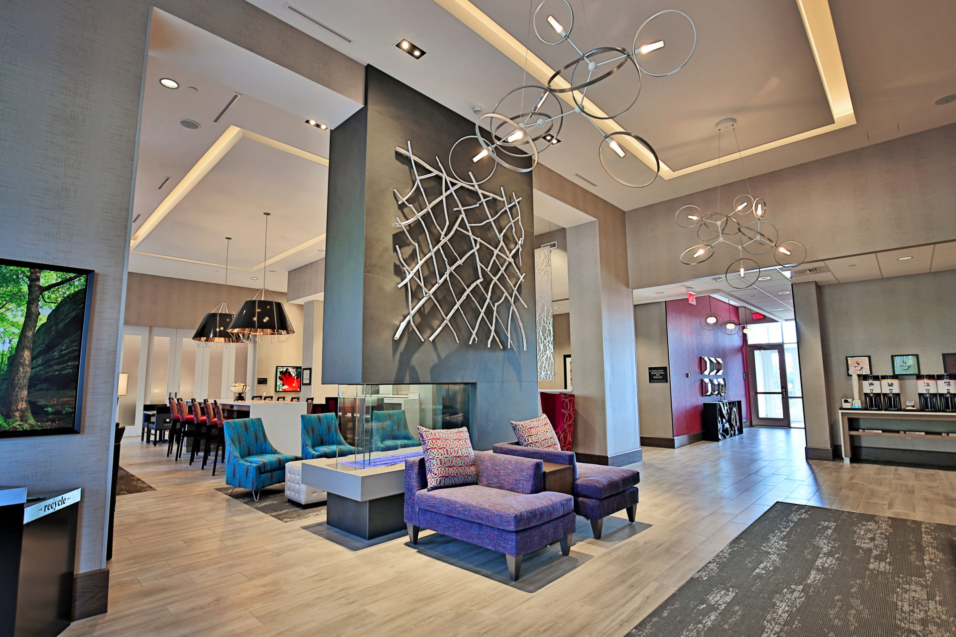 Lobby with double-sided fireplace at Hampton Inn & Suites — Biltmore Area